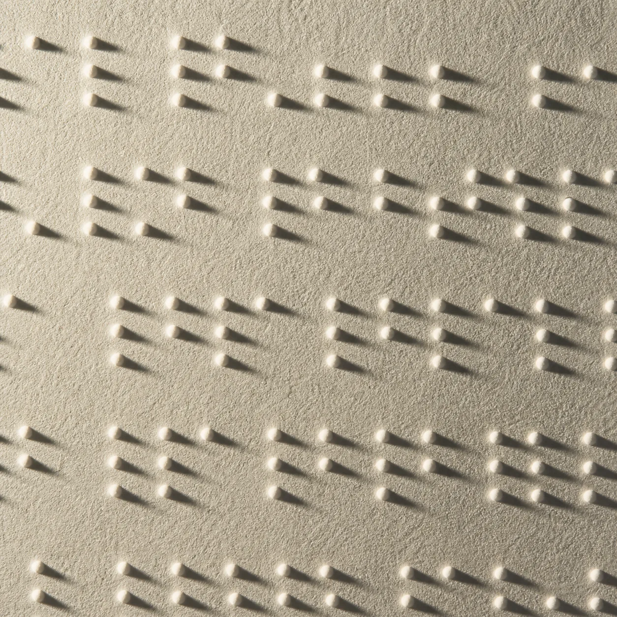 Close-up of tactile Braille dots on premium paper